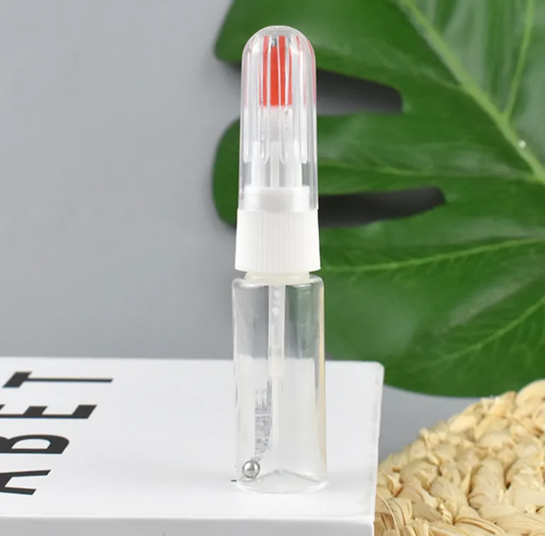 Botella vacía de pintura para retocar con punta de pincel